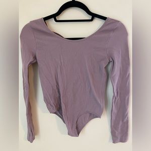 Low back long sleeve purple bodysuit